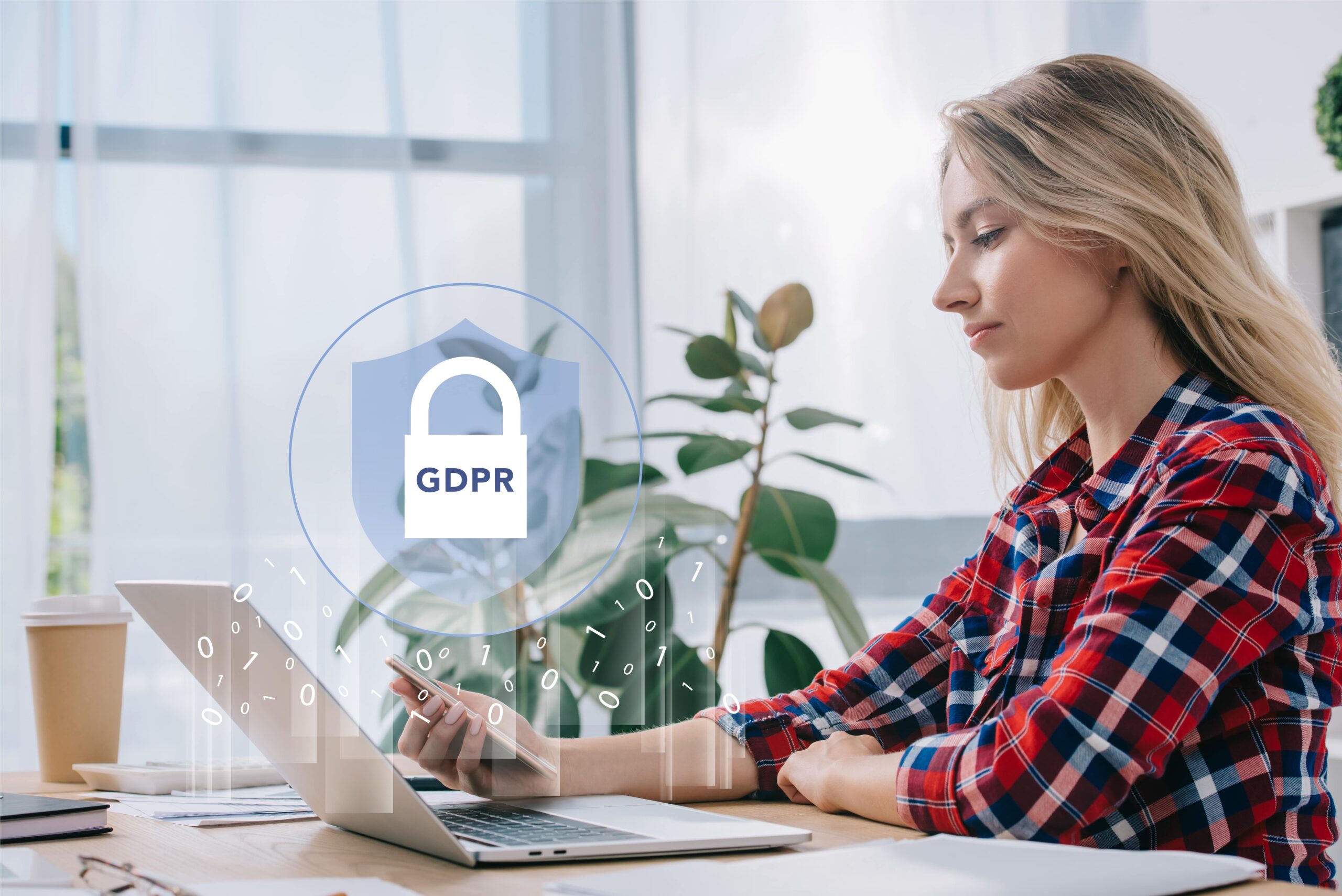 side-view-of-businesswoman-using- laptop with GDPR on screen